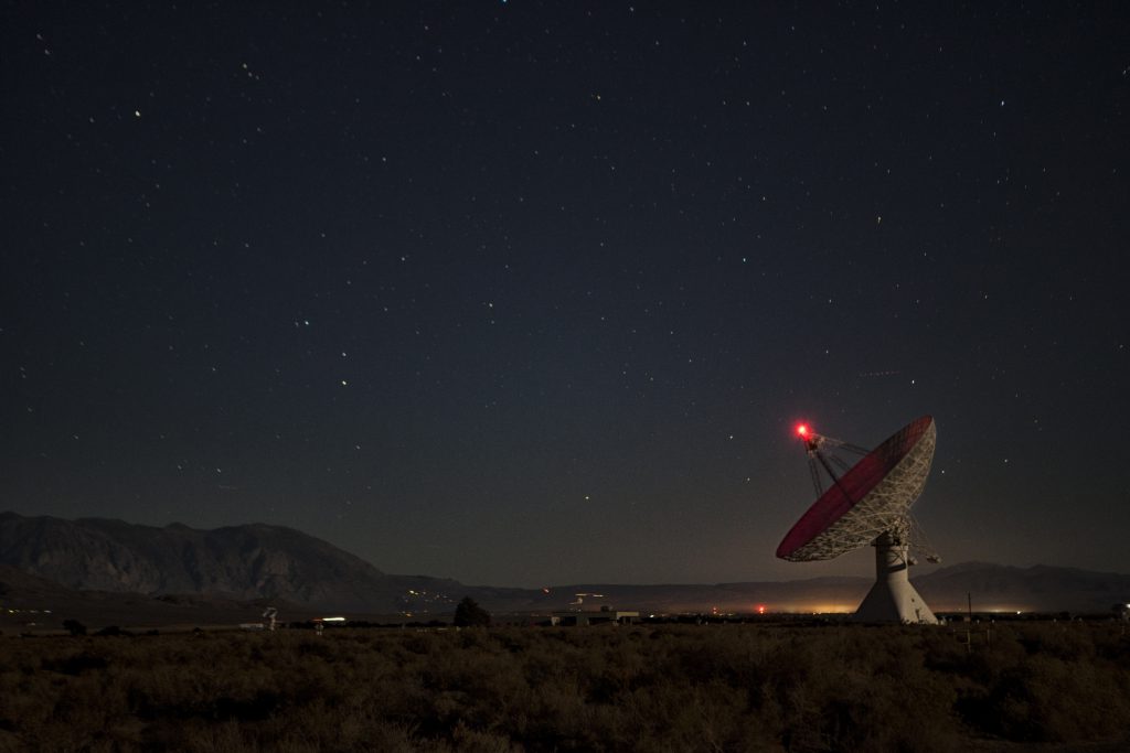 Satellite dish scanning the night sky | Mission Essential